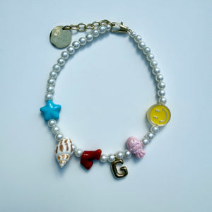 ´SUNNY SMILES’ FAUX PEARL CHARM NECKLACE BY BOOM BESPOKE
