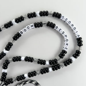 ´BOOMONO’ BLACK & WHITE ADJUSTABLE CROSSBODY PHONE STRAP