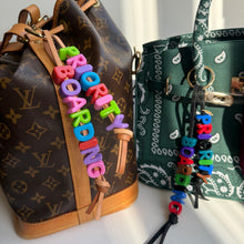 Load image into Gallery viewer, ‘PRIORITY BOARDING’ CHUNKY LEATHER BEADED BAG CHARM BY BOOM BESPOKE
