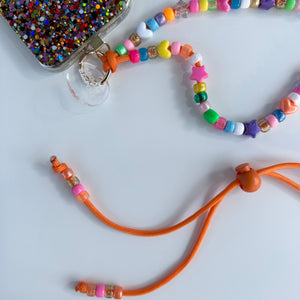‘VITAMIN C’ ORANGE ADJUSTABLE CROSSBODY PHONE STRAP